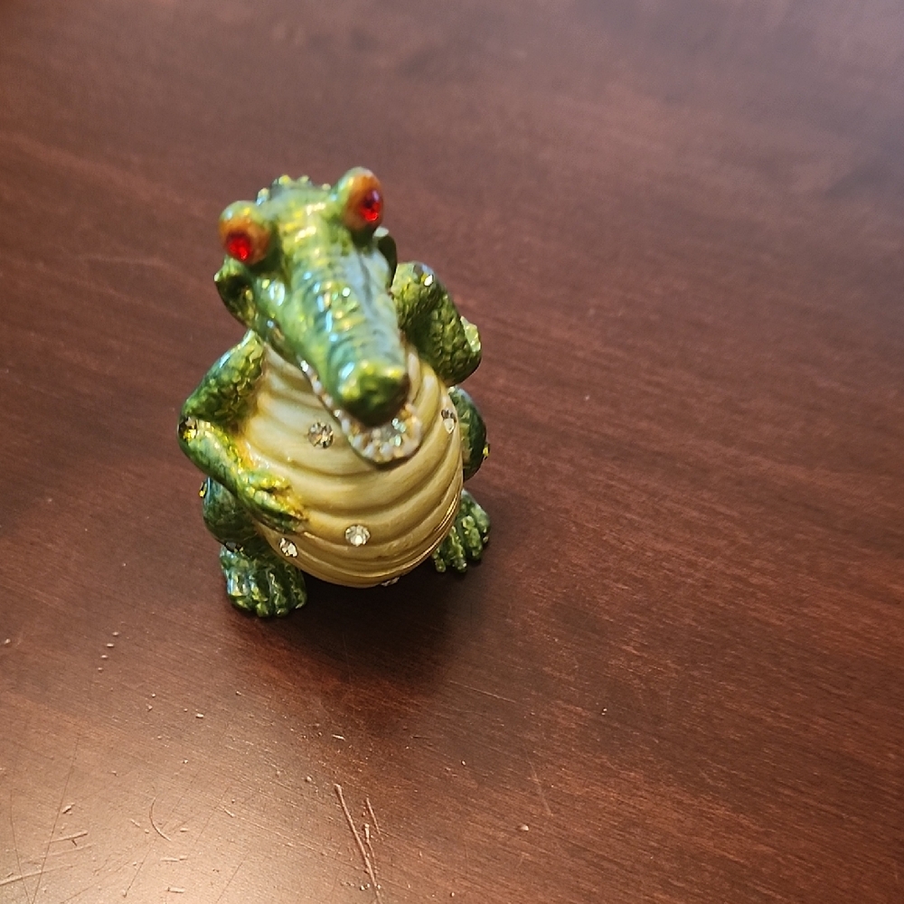 Whimsical Green and Tan Reptile Figurine with Expressive Eyes